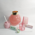 pink glass flower vase with golden rim